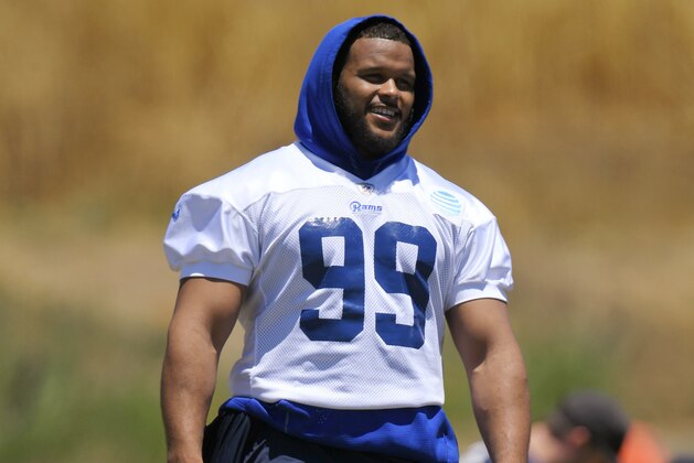 Los Angeles Rams defensive tackle Aaron Donald stands on the field during NFL football practice, Tuesday, June 13, 2017, in Thousand Oaks, Calif. (AP Photo/Mark J. Terrill)