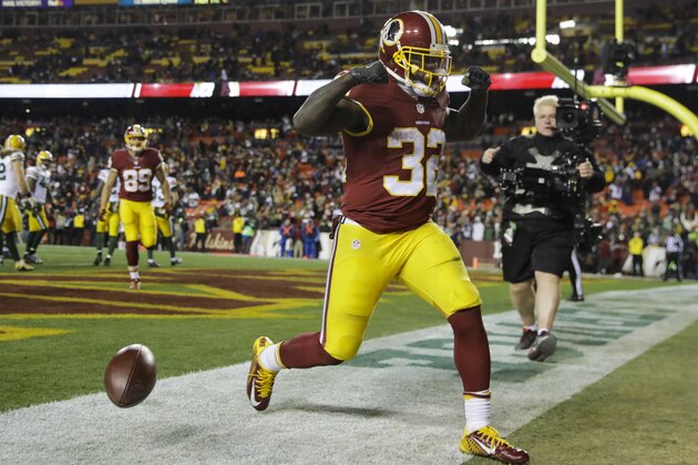 FILE - In this Nov. 20, 2016, file photo, Washington Redskins running back Rob Kelley (32) celebrates his touchdown during the second half of an NFL football game against the Green Bay Packers, in Landover, Md. The surprising success by such low-profile rushers as Jay Ajayi, Jordan Howard, Robert Kelley and Tim Hightower speaks to the challenge of evaluating running backs _ and the high injury rate at the position. (AP Photo/Patrick Semansky, File)