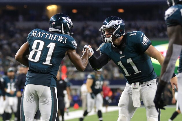 Philadelphia Eagles wide receiver Jordan Matthews (81) and quarterback Carson Wentz (11) celebrate a touchdown scored by Matthews on a pass from Went in the second half of an NFL football game against the Dallas Cowboys on Sunday, Oct. 30, 2016, in Arlington, Texas. (AP Photo/Ron Jenkins)