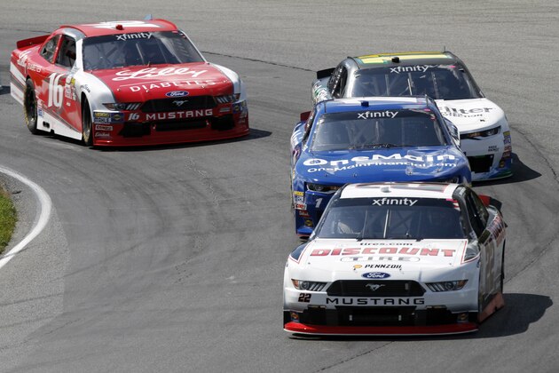 Sam Hornish Jr. (22) leads Elliott Sadler (1), Blake Koch (11) and Ryan Reed (16) through a corner on the first lap during the NASCAR Xfinity Series auto race, Saturday, Aug. 12, 2017, at Mid Ohio Sports Car Course in Lexington, Ohio. (AP Photo/Tom E. Puskar)