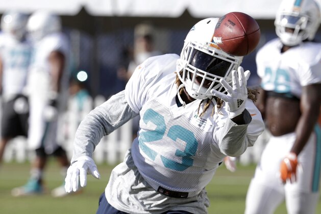 Miami Dolphins running back Jay Ajayi (23) does drills during an NFL football training camp, Tuesday, Aug. 8, 2017, in Davie, Fla. (AP Photo/Lynne Sladky)
