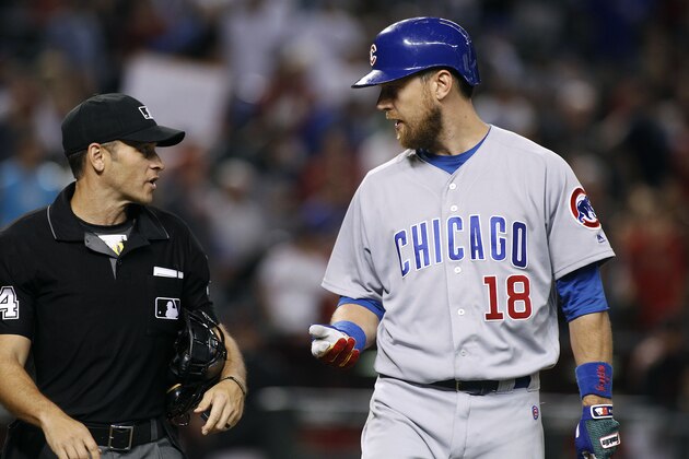 Chicago Cubs' Ben Zobrist (18) talks with home plate umpire Mark Wegner after being called out on strikes to end the baseball game against the Arizona Diamondbacks on Saturday, Aug. 12, 2017, in Phoenix. The Diamondbacks defeated the Cubs 6-2. (AP Photo/Ralph Freso)
