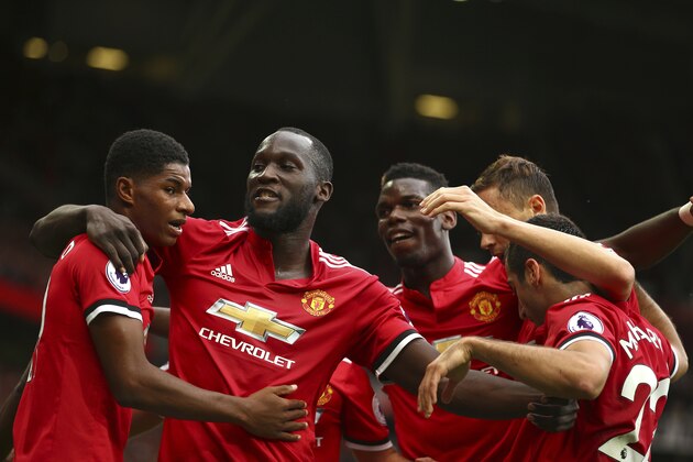 Manchester United's Romelu Lukaku, second left, celebrates scoring his side's first goal of the game during the English Premier League soccer match between Manchester United and West Ham United at Old Trafford in Manchester, England, Sunday, Aug. 13, 2017. (AP Photo/Dave Thompson)