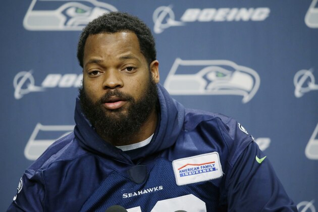 FILE -- In this Jan. 10, 2017 file photo, Seattle Seahawks defensive end Michael Bennett talks to reporters, in Renton, Wash. In a letter posted on Twitter Saturday, Feb. 11, 2017, the American professional football player pulled out of a planned trip to Israel, accusing its government of trying to use him for PR purposes. Bennett cited Muhammad Ali's support for the Palestinians, saying he too wanted to be a