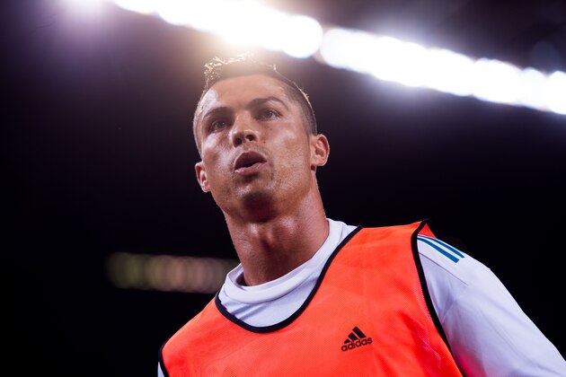 BARCELONA, SPAIN - AUGUST 13:  Cristiano Ronaldo of Real Madrid CF looks on as he warms up during the Supercopa de Espana Supercopa Final 1st Leg match between FC Barcelona and Real Madrid at Camp Nou on August 13, 2017 in Barcelona, Spain.  (Photo by Alex Caparros/Getty Images)