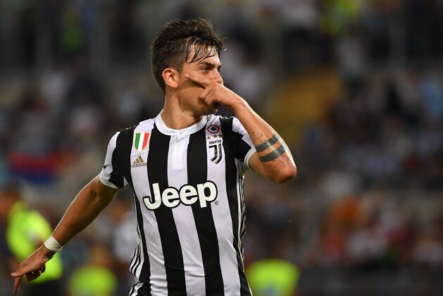 Juventus's forward from Argentina Paulo Dybala celebrtaes after scoring a penalty during the Italian SuperCup TIM football match Juventus vs lazio on August 13, 2017 at the Olympic stadium in Rome.  / AFP PHOTO / ALBERTO PIZZOLI        (Photo credit should read ALBERTO PIZZOLI/AFP/Getty Images)