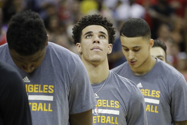 Los Angeles Lakers' Lonzo Ball listens to the national anthem before the team's NBA summer league basketball game against the Portland Trail Blazers, Monday, July 17, 2017, in Las Vegas. (AP Photo/John Locher)