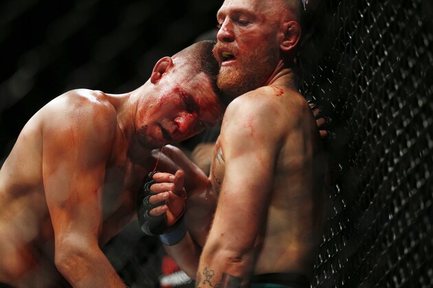 Conor McGregor fights Nate Diaz during their welterweight mixed martial arts bout at UFC 202 on Saturday, Aug. 20, 2016, in Las Vegas. McGregor won by split decision. (AP Photo/Isaac Brekken)