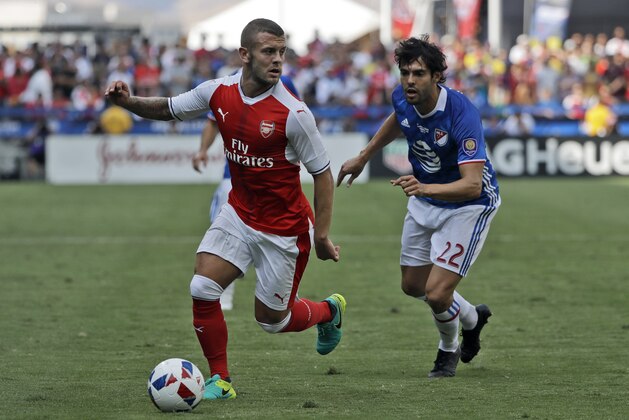 Arsenal midfielder Jack Wilshere, left, controls the ball next to MLS All-Stars' Kaka during the first half of the MLS All-Star soccer game Thursday, July 28, 2016, in San Jose, Calif. (AP Photo/Marcio Jose Sanchez)