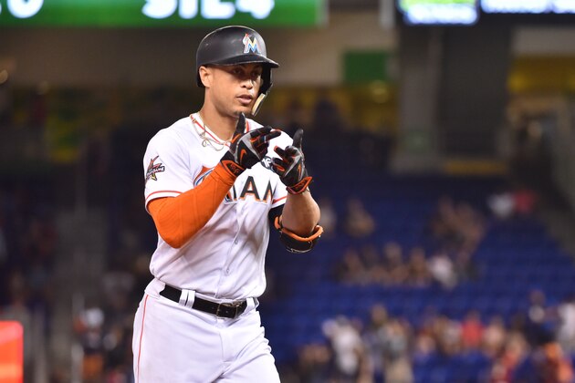 MIAMI, FL - AUGUST 11: Giancarlo Stanton #27 of the Miami Marlins points towards the dugout after hitting his 40th home run of the season in the sixth inning against the Colorado Rockies at Marlins Park on August 11, 2017 in Miami, Florida. (Photo by Eric Espada/Getty Images)