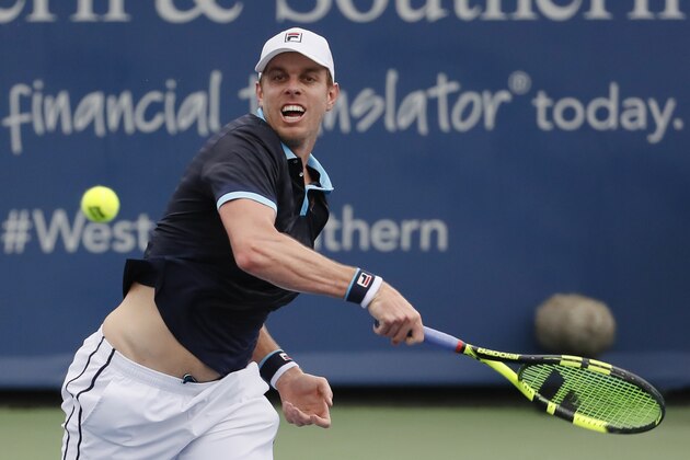 Sam Querrey returns to Stefan Kozlov during the first round at the Western & Southern Open tennis tournament, Monday, Aug. 14, 2017, in Mason, Ohio. (AP Photo/John Minchillo)