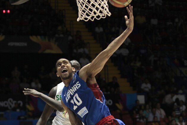 Philippines' Gabe Norwood  foregound in action against Senegal during the Group B Basketball World Cup match in Seville, Spain, Thursday, Sept. 4, 2014. The 2014 Basketball World Cup competition will take place in various cities in Spain from Aug. 30 through to Sept. 14. (AP Photo/Miguel Angel Morenatti)