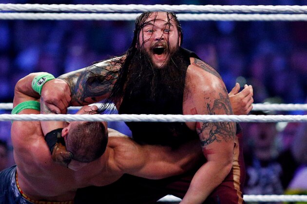 John Cena, left, and Bray Wyatt, right, compete during Wrestlemania XXX at the Mercedes-Benz Super Dome in New Orleans on Sunday, April 6, 2014. (Jonathan Bachman/AP Images for WWE)
