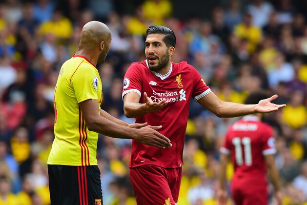 WATFORD, ENGLAND - AUGUST 12: Emre Can of Liverpool and Younes Kaoul of Watford argue during the Premier League match between Watford and Liverpool at Vicarage Road on August 12, 2017 in Watford, England.  (Photo by Tony Marshall/Getty Images)