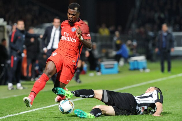 Angers' French midfielder Baptiste Santamaria (R)  vies with Paris Saint-Germain's Ivorian defender Serge Aurier during the French L1 football match Angers against Paris Saint-Germain (PSG) on April 14, 2017 at the Raymond Kopa stadium in Angers, western of France.  / AFP PHOTO / FRED TANNEAU        (Photo credit should read FRED TANNEAU/AFP/Getty Images)