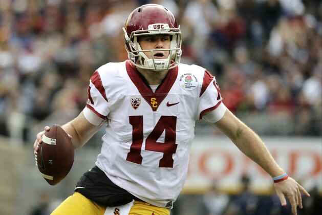 FILE - In this Jan. 2, 2017, file photo, Southern California quarterback Sam Darnold looks to pass against Penn State during the Rose Bowl NCAA college football game in Pasadena, Calif. Southern California and Washington are the strong favorites to win their respective Pac-12 divisions. (AP Photo/Jae C. Hong, File)