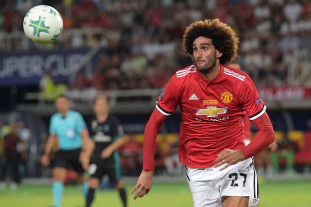 Manchester United's Belgian midfielder Marouane Fellaini eyes the ball during the UEFA Super Cup football match between Real Madrid and Manchester United on August 8, 2017, at the Philip II Arena in Skopje. / AFP PHOTO / ARMEND NIMANI        (Photo credit should read ARMEND NIMANI/AFP/Getty Images)