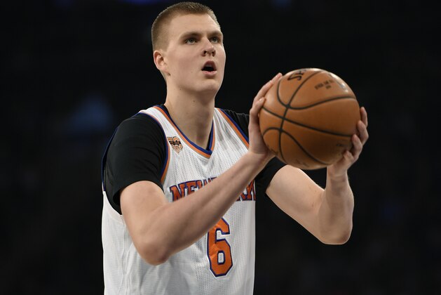 New York Knicks forward Kristaps Porzingis takes aim for a foul shot in the first half of an NBA basketball game against the Utah Jazz in New York, Sunday, Nov. 6, 2016. (AP Photo/Kathy Kmonicek)