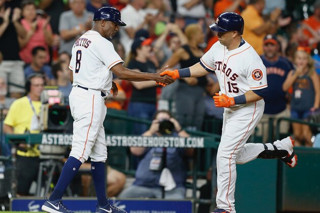 HOUSTON, TX - AUGUST 01:  Carlos Beltran #15 of the Houston Astros is congratulated by third base coach Gary Pettis #8 after hitting a home run in the fifth inning against the Tampa Bay Rays at Minute Maid Park on August 1, 2017 in Houston, Texas.  (Photo by Bob Levey/Getty Images)