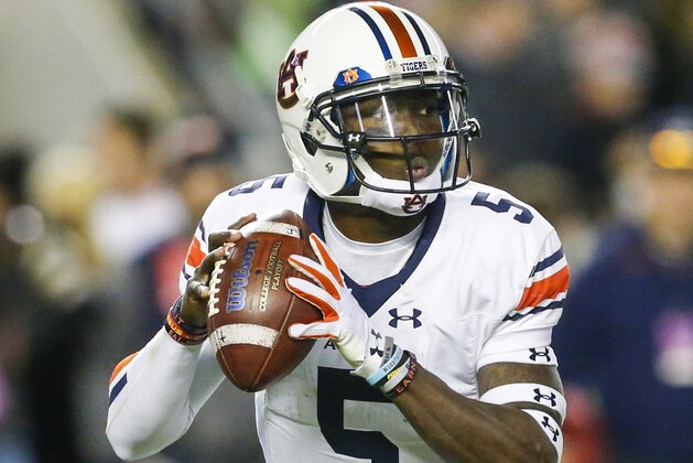 Auburn quarterback John Franklin III (5) drops back to pass against Alabama during the second half of the Iron Bowl NCAA college football game, Saturday, Nov. 26, 2016, in Tuscaloosa, Ala. (AP Photo/Butch Dill)
