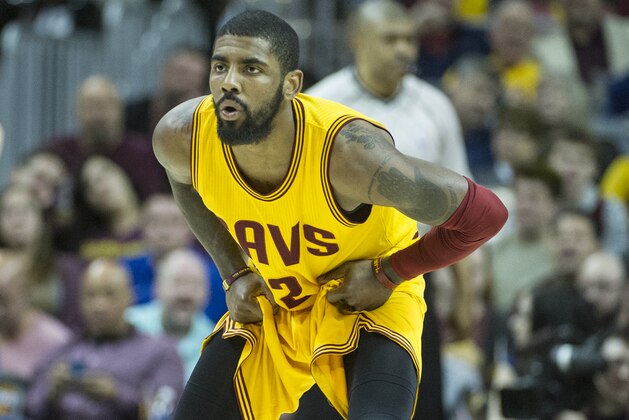 Cleveland Cavaliers' Kyrie Irving (2) watches the Washington Wizards bring the ball up court  during the first half of an NBA basketball game in Cleveland, Saturday, March 25, 2017. (AP Photo/Phil Long)