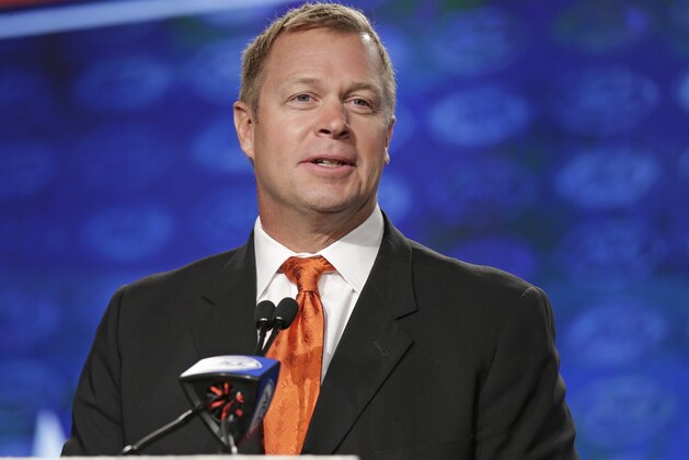 Virginia head coach Bronco Mendenhall speaks to the media during the Atlantic Coast Conference NCAA college football media day in Charlotte, N.C., Friday, July 14, 2017. (AP Photo/Chuck Burton)