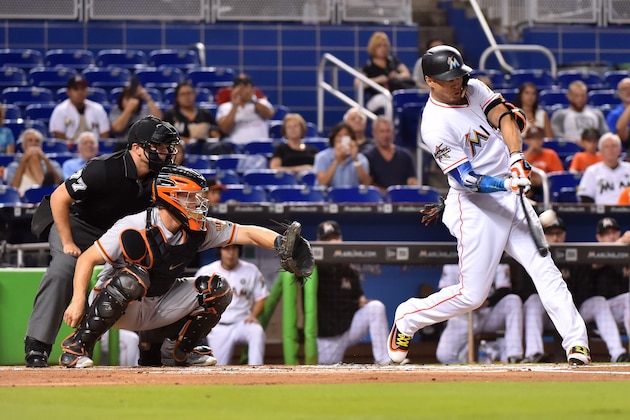 MIAMI, FL - AUGUST 14: Giancarlo Stanton #27 of the Miami Marlins hits his 43rd homer of the season in the first inning against the San Francisco Giants at Marlins Park on August 14, 2017 in Miami, Florida. (Photo by Eric Espada/Getty Images)