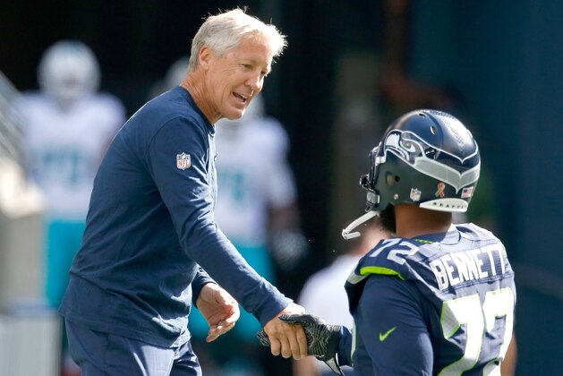 SEATTLE, WA - SEPTEMBER 11: Head coach Pete Carroll of the Seattle Seahawks greets defensive end Michael Bennett #72 before an NFL game against the Miami Dolphins at CenturyLink Field on September 11, 2016 in Seattle, Washington. (Photo by Otto Greule Jr/Getty Images) SEATTLE, WA - SEPTEMBER 11: Head coach Pete Carroll of the Seattle Seahawks greets defensive end Michael Bennett #72 before an NFL game against the Miami Dolphins at CenturyLink Field on September 11, 2016 in Seattle, Washington. (Photo by Otto Greule Jr/Getty Images)