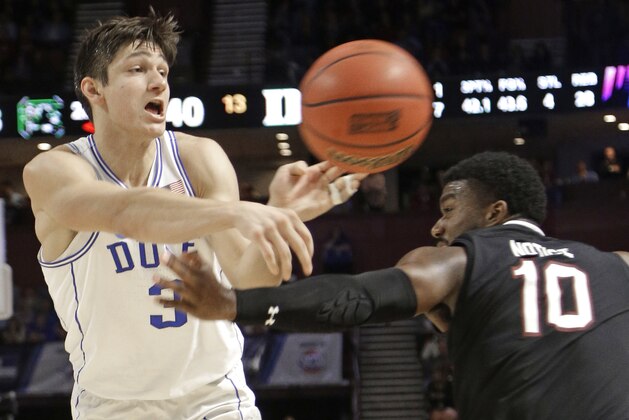 Duke's Grayson Allen (3) passes the ball as South Carolina's Duane Notice (10) defends during the second half in a second-round game of the NCAA men's college basketball tournament in Greenville, S.C., Sunday, March 19, 2017. (AP Photo/Chuck Burton)