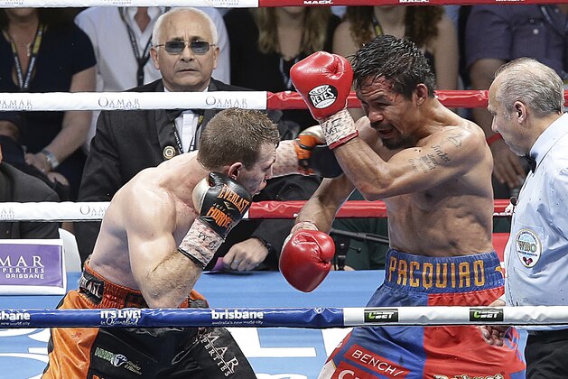 Manny Pacquiao of the Philippines, left, and Jeff Horn of Australia fight during their WBO World welterweight title bout in Brisbane, Australia, Sunday, July 2, 2017. Pacquiao lost his WBO welterweight world title to Horn in a stunning, unanimous points decision in the Sunday afternoon bout billed as the Battle of Brisbane in front of more than 50,000 people. (AP Photo/Tertius Pickard)