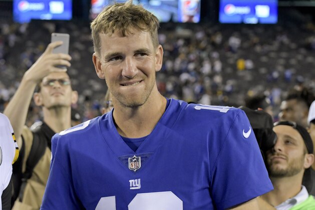 New York Giants quarterback Eli Manning (10) walks off the field after a preseason NFL football game against the Pittsburgh Steelers, Friday, Aug. 11, 2017, in East Rutherford, N.J. (AP Photo/Bill Kostroun)