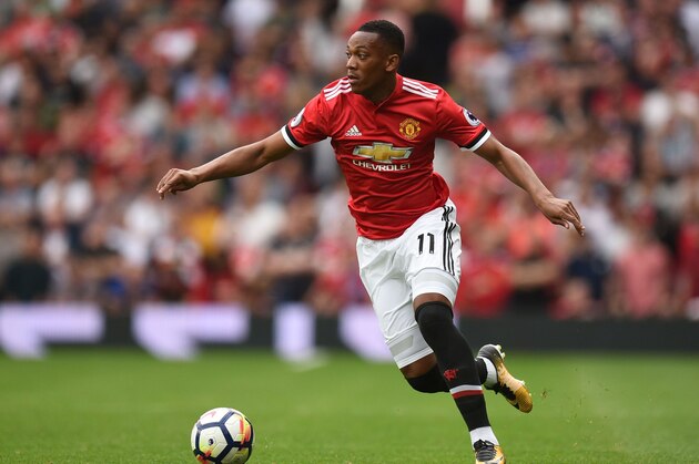 Manchester United's French striker Anthony Martial runs with the ball during the English Premier League football match between Manchester United and West Ham United at Old Trafford in Manchester, north west England, on August 13, 2017. / AFP PHOTO / Oli SCARFF / RESTRICTED TO EDITORIAL USE. No use with unauthorized audio, video, data, fixture lists, club/league logos or 'live' services. Online in-match use limited to 75 images, no video emulation. No use in betting, games or single club/league/player publications.  /         (Photo credit should read OLI SCARFF/AFP/Getty Images)
