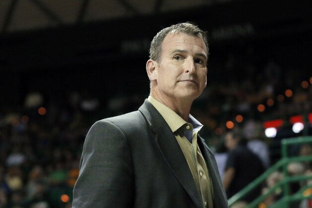 Baylor athletic director Mack Rhoades takes in play during a women's NCAA college basketball game against UCLA on Monday Nov. 14, 2016, in Waco, Texas. (AP Photo/Tony Gutierrez)