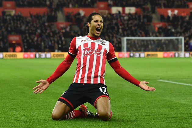Southampton's Dutch defender Virgil van Dijk celebrates scoring the opening goal during the English Premier League football match between Southampton and Tottenham Hotspur at St Mary's Stadium in Southampton, southern England on December 28, 2016. / AFP / Glyn KIRK / RESTRICTED TO EDITORIAL USE. No use with unauthorized audio, video, data, fixture lists, club/league logos or 'live' services. Online in-match use limited to 75 images, no video emulation. No use in betting, games or single club/league/player publications.  /         (Photo credit should read GLYN KIRK/AFP/Getty Images)