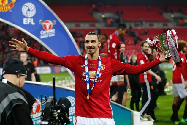 TOPSHOT - Manchester United's Swedish striker Zlatan Ibrahimovic celebrates with the trophy on the pitch after their victory in the English League Cup final football match between Manchester United and Southampton at Wembley stadium in north London on February 26, 2017.
Zlatan Ibrahimovic sealed the first major silverware of Jose Mourinho's Manchester United reign and broke Southampton's hearts as the Swedish star's late goal clinched a dramatic 3-2 victory in Sunday's League Cup final. / AFP PHOTO / Ian KINGTON / RESTRICTED TO EDITORIAL USE. No use with unauthorized audio, video, data, fixture lists, club/league logos or 'live' services. Online in-match use limited to 75 images, no video emulation. No use in betting, games or single club/league/player publications.  /         (Photo credit should read IAN KINGTON/AFP/Getty Images)