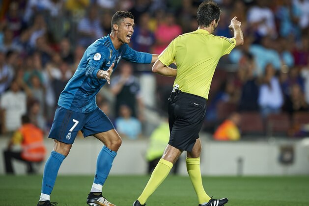 BARCELONA, SPAIN - AUGUST 13:  Cristiano Ronaldo (L) of Real Madrid reacts after a red card during the Supercopa de Espana Supercopa Final 1st Leg match between FC Barcelona and Real Madrid at Camp Nou on August 13, 2017 in Barcelona, Spain.  (Photo by fotopress/Getty Images)