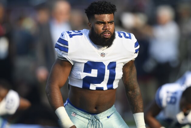 Dallas Cowboys running back Ezekiel Elliott walks on the field prior to the Pro Football Hall of Fame NFL preseason game in Canton, Ohio, Thursday, Aug. 3, 2017. (AP Photo/David Richard)