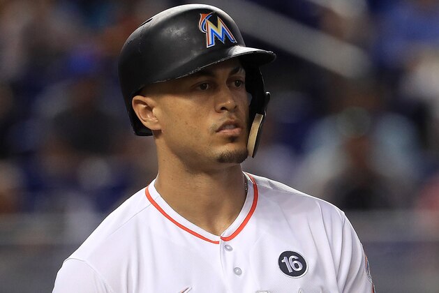 MIAMI, FL - AUGUST 16: Giancarlo Stanton #27 of the Miami Marlins reacts to being by a pitch in the second inning during a game against the San Francisco Giants at Marlins Park on August 16, 2017 in Miami, Florida. (Photo by Mike Ehrmann/Getty Images) MIAMI, FL - AUGUST 16: Giancarlo Stanton #27 of the Miami Marlins reacts to being by a pitch in the second inning during a game against the San Francisco Giants at Marlins Park on August 16, 2017 in Miami, Florida. (Photo by Mike Ehrmann/Getty Images)