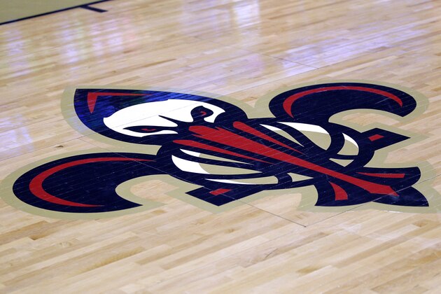 The New Orleans Pelicans' logo is seen before an NBA basketball game against the Golden State Warriors in New Orleans, Saturday, Jan. 18, 2014. (AP Photo/Jonathan Bachman)