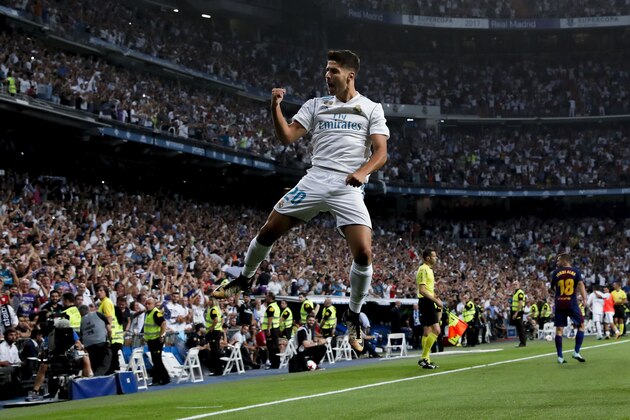 MADRID, SPAIN - AUGUST 16:  Marco Asensio of Real Madrid CF celebrates scoring their opening goal during the Supercopa de Espana Final 2nd Leg match between Real Madrid and FC Barcelona at Estadio Santiago Bernabeu on August 16, 2017 in Madrid, Spain.  (Photo by Gonzalo Arroyo Moreno/Getty Images)
