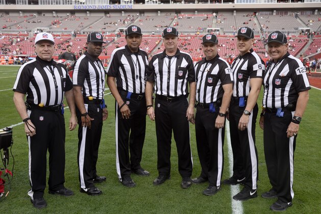 Referee Walt Anderson (66), field judge John Jenkins (117), line judge Byron Boston (18), umpire Butch Hannah (40), back judge Greg Wilson (119), head linesman Jerod Phillips (6) and side judge Laird Hayes (125) before the NFL football game between the Tampa Bay Buccaneers and the New Orleans Saints Sunday, Dec. 11, 2016, in Tampa, FL, Fla. (AP Photo/Jason Behnken)