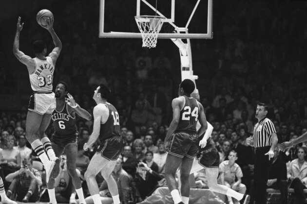 The Lakers' Tommy Hawkins fries a jump shot against the Boston Celtics in their NBA playoff game at Los Angeles May 2, 1968. At right are Bill Russell (6) and Bailey Howell. Hawkins hit several in the opening minutes. (AP Photo/HF) The Lakers' Tommy Hawkins fries a jump shot against the Boston Celtics in their NBA playoff game at Los Angeles May 2, 1968. At right are Bill Russell (6) and Bailey Howell. Hawkins hit several in the opening minutes. (AP Photo/HF)