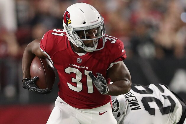 GLENDALE, AZ - AUGUST 12:  Running back David Johnson #31 of the Arizona Cardinals rushes the football past cornerback David Amerson #29 of the Oakland Raiders during the NFL game at the University of Phoenix Stadium on August 12, 2017 in Glendale, Arizona. The Cardinals defeated the Raiders 20-10.  (Photo by Christian Petersen/Getty Images)