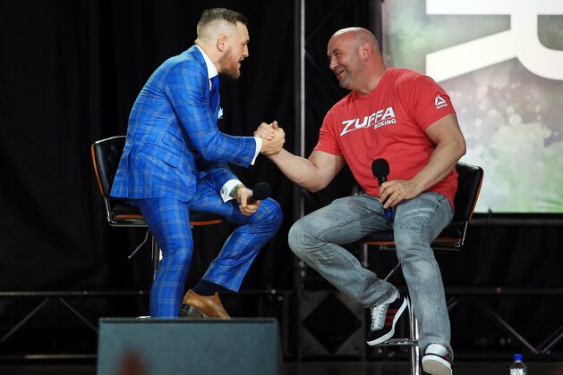 TORONTO, ON - JULY 12:   Conor McGregor shakes hands with UFC President Dana White during the Floyd Mayweather Jr. v Conor McGregor World Press Tour at Budweiser Stage on July 12, 2017 in Toronto, Canada.  (Photo by Vaughn Ridley/Getty Images)