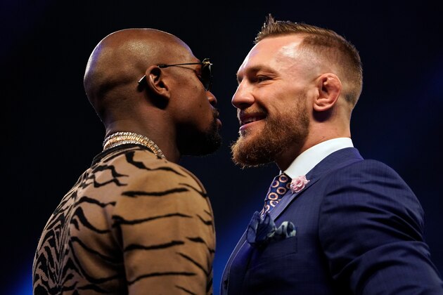 LONDON, ENGLAND - JULY 14:  (R-L) Conor McGregor and Floyd Mayweather Jr. face off during the Floyd Mayweather Jr. v Conor McGregor World Press Tour event at SSE Arena on July 14, 2017 in London, England. (Photo by Jeff Bottari/Zuffa LLC/Zuffa LLC via Getty Images)