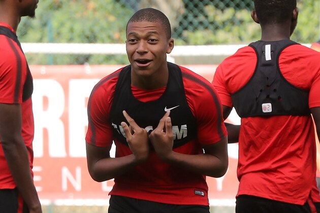 Monaco L1 football club's forward Kylian Mbappe Lottin takes part in a training session on August 11, 2017 in La Turbie, near Monaco.   / AFP PHOTO / VALERY HACHE        (Photo credit should read VALERY HACHE/AFP/Getty Images)