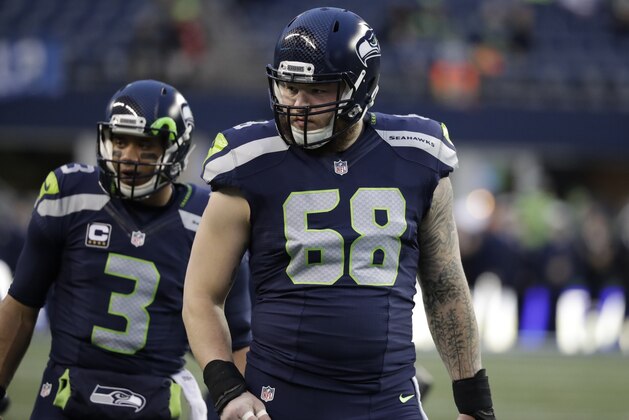 Seattle Seahawks center Justin Britt (68) stands next to quarterback Russell Wilson (3) during warmups before an NFL football NFC wild card playoff game against the Detroit Lions, Saturday, Jan. 7, 2017, in Seattle. (AP Photo/Elaine Thompson)