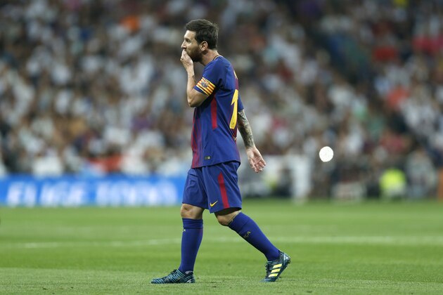 Barcelona's Lionel Messi walks along the pitch during the Spanish Super Cup second leg soccer match between Real Madrid and Barcelona at the Santiago Bernabeu Stadium in Madrid, Wednesday, Aug. 16, 2017. Real Madrid won 5-1 on aggregate. (AP Photo/Francisco Seco)