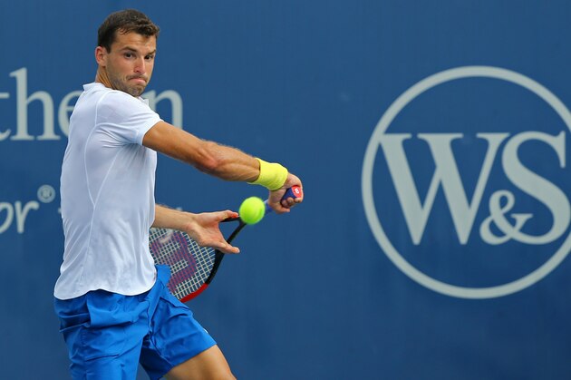 Aug 17, 2017; Mason, OH, USA; Grigor Dimitrov (BUL) returns a shot against Juan Martin del Potro (ARG) during the Western and Southern Open at the Lindner Family Tennis Center. Mandatory Credit: Aaron Doster-USA TODAY Sports