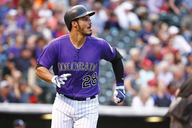 Colorado Rockies' Nolan Arenado looks at the flight of a solo home run ball hit against Atlanta Braves starting pitcher Sean Newcomb during the first inning of a baseball game Tuesday, Aug. 15, 2017, in Denver. (AP Photo/Jack Dempsey)